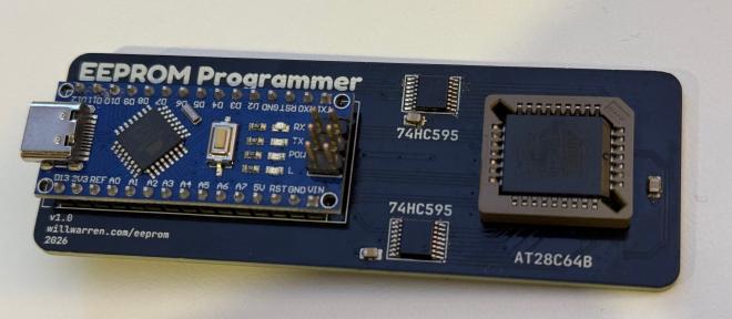 Photo of the EEPROM programmer. An Arduino Nano clone can be seen on the left, and the socketed EEPROM is visible on the right.