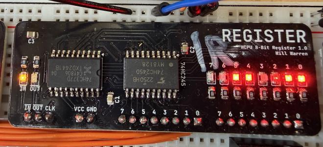 Photo of the generic Register PCB. It has 2 big-ish IC’s on it (the 74HC377 and the 74HC245) and 8 red LEDs