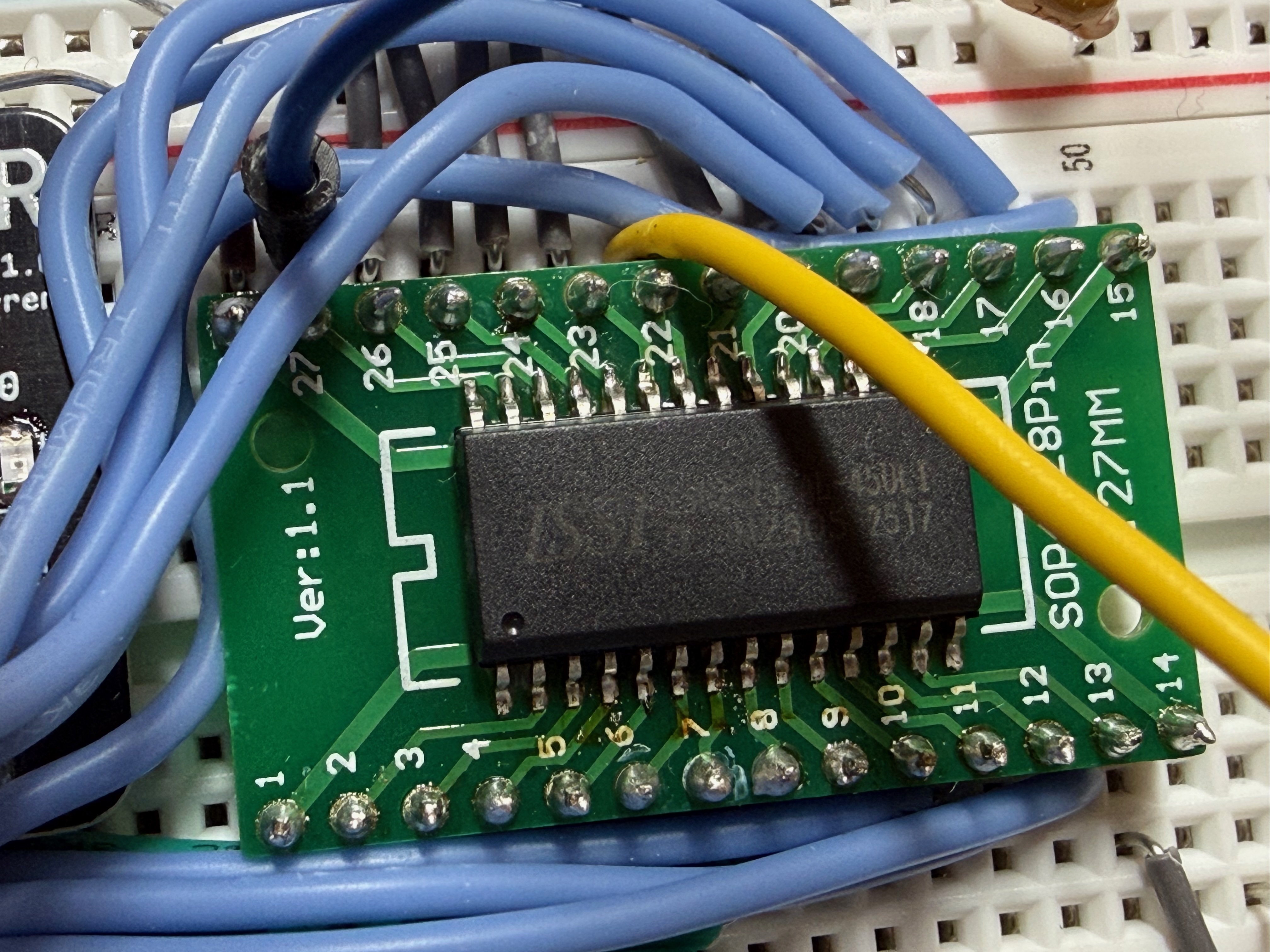 Photo of an IS62C256AL soldered onto an adapter board. The combined size is larger than the DIP package would have been.